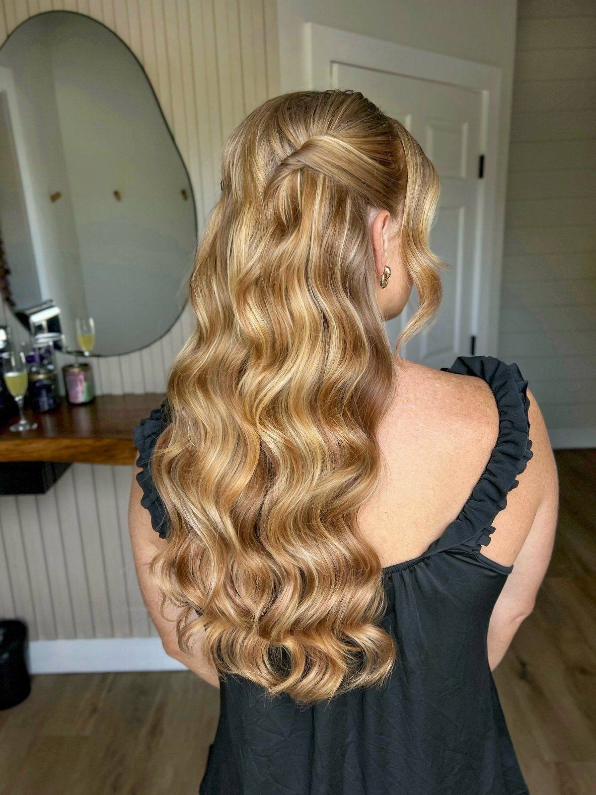 11 Half Up Half Down Wedding Hair Styles You'll Love 5 Blonde wavy hair with top layers pinned back and loose curls falling down.