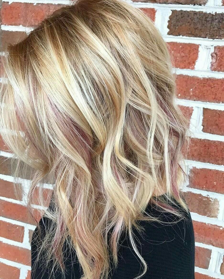 Blonde Hair with Rose Gold Highlights: 5 Ways to Wear It 5 Wavy blonde hair with subtle rose gold highlights and lowlights against a brick wall background.