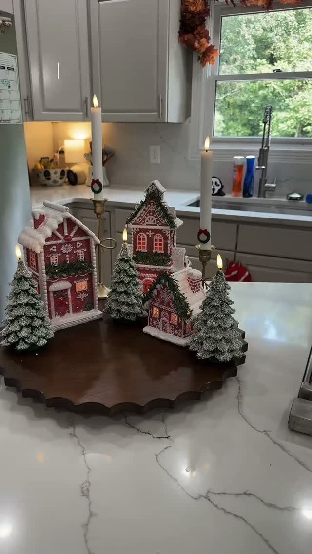 14 Candle Table Decor Ideas for Centerpieces That Feel Considered 13 Miniature gingerbread houses and snowy trees arranged with taper candles on a wooden tray.