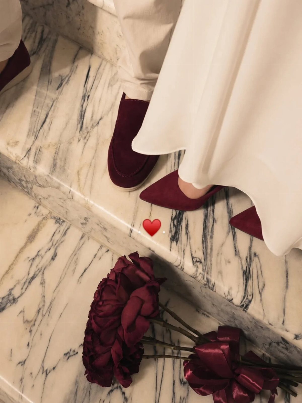 12 Dark Red Wedding Theme Ideas With Floral, Cake and Gown Picks 9 Burgundy suede shoes worn by people standing on white marble stairs near red flowers.