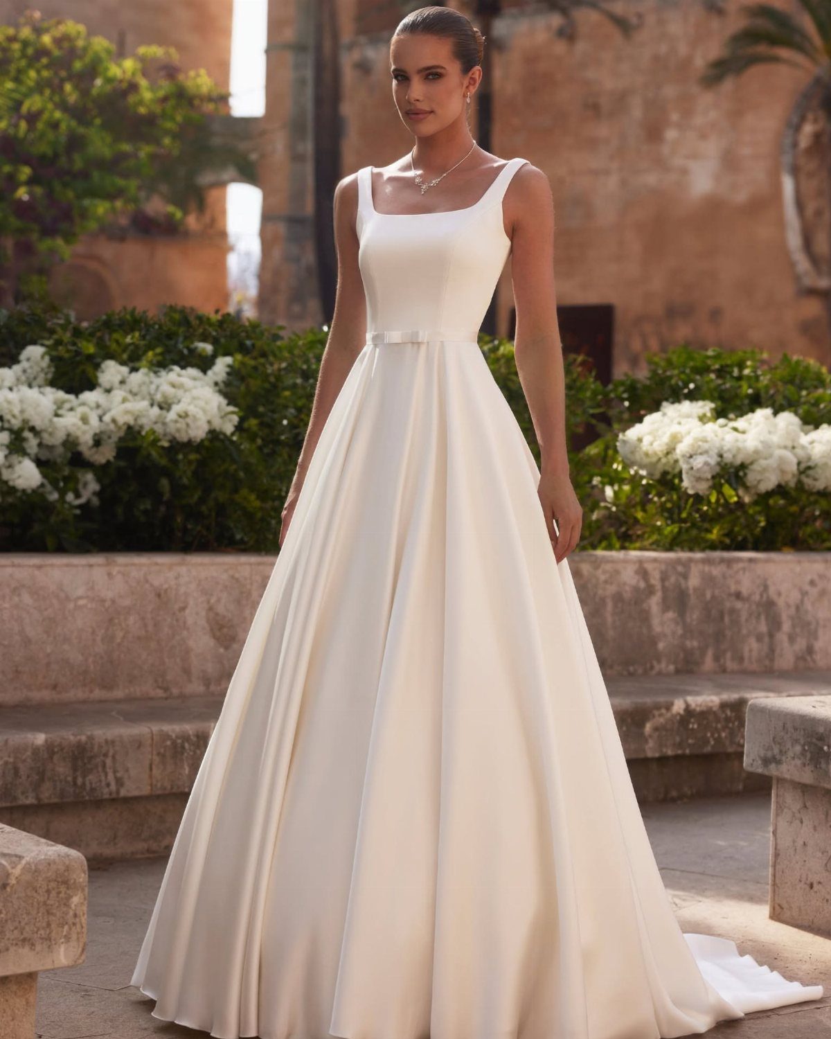 Elegant Princess Wedding Dress Styles in 27 Ideas 8 Woman in a structured white mikado fabric wedding dress with a square neckline