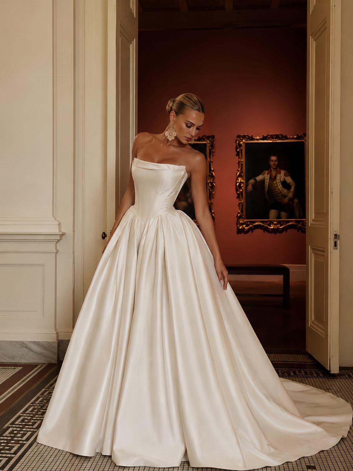 Elegant Princess Wedding Dress Styles in 27 Ideas 6 Woman in a strapless white satin wedding dress with a full princess skirt