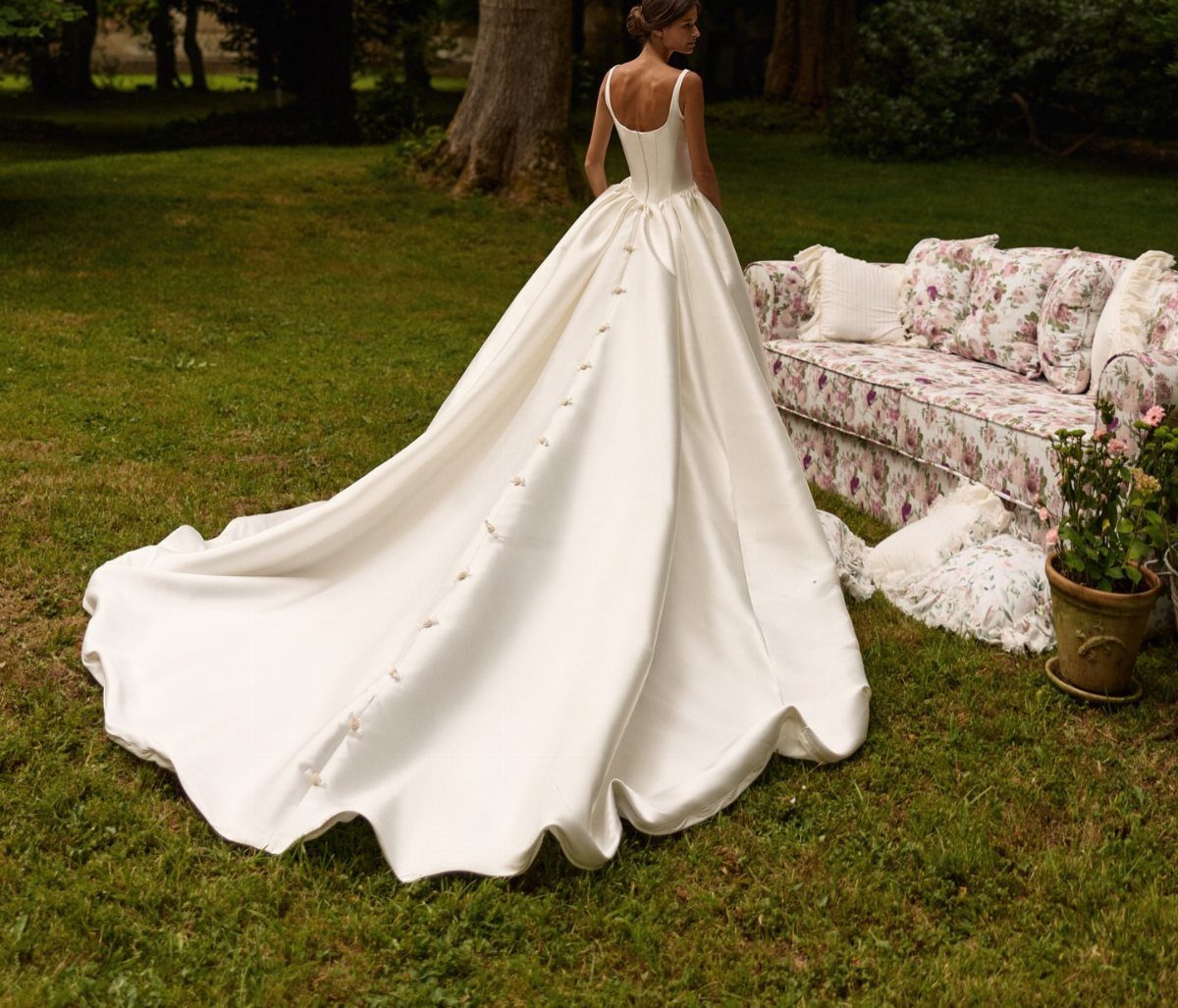 Elegant Princess Wedding Dress Styles in 27 Ideas 12 White satin wedding dress with a long sweeping train on a green lawn