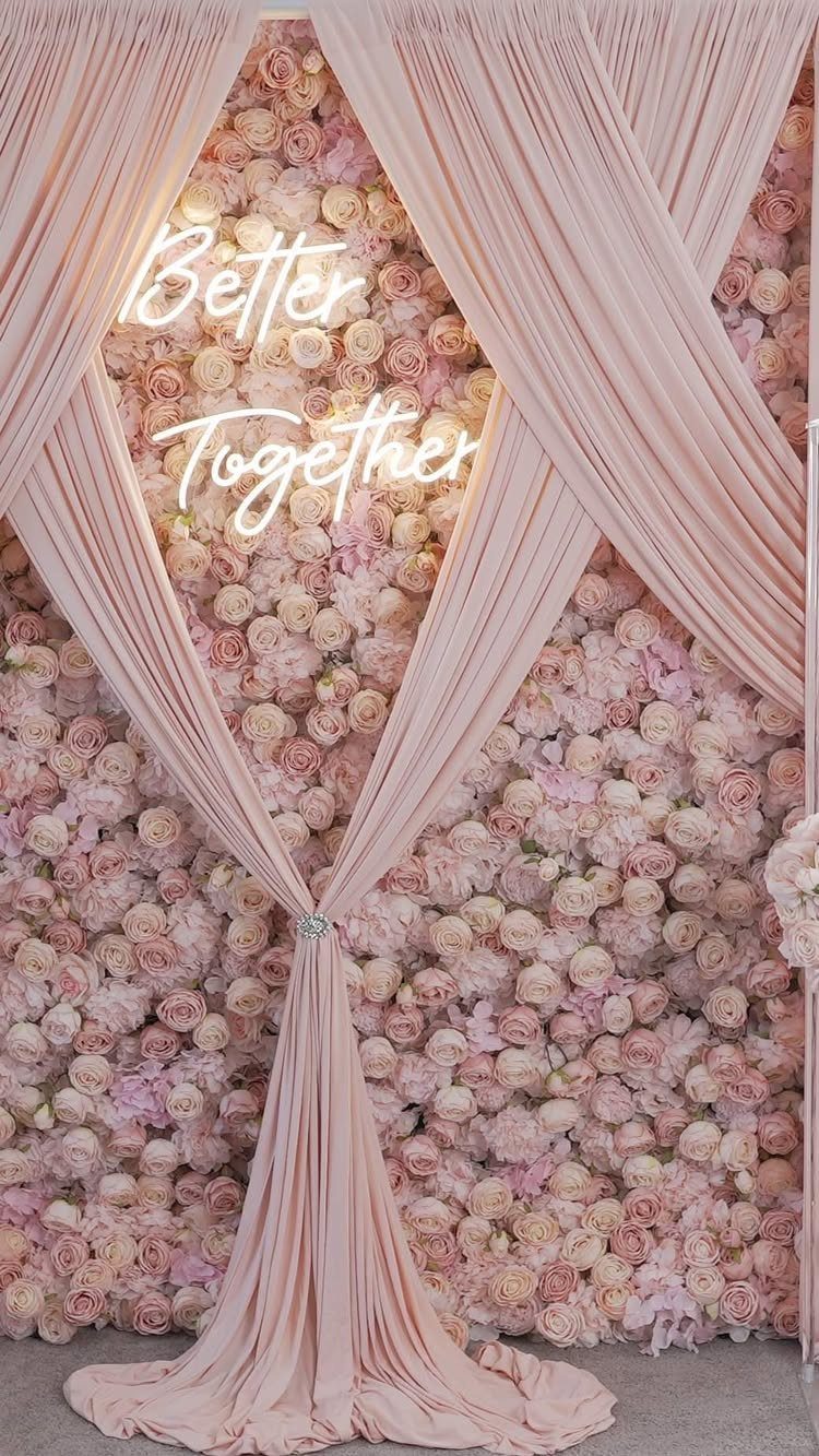 Flowers for Wedding Reception: 11 Elegant Ideas to Style Your Space 7 Flower wall with pink roses, draped fabric, and a Better Together neon sign.