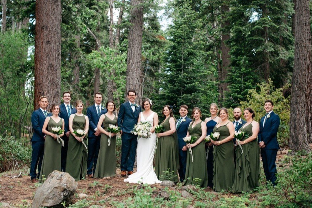 Forest Green for Wedding Colors: 10 Ideas to Try 7 Wedding party in forest green bridesmaid dresses and navy blue suits standing among tall trees.