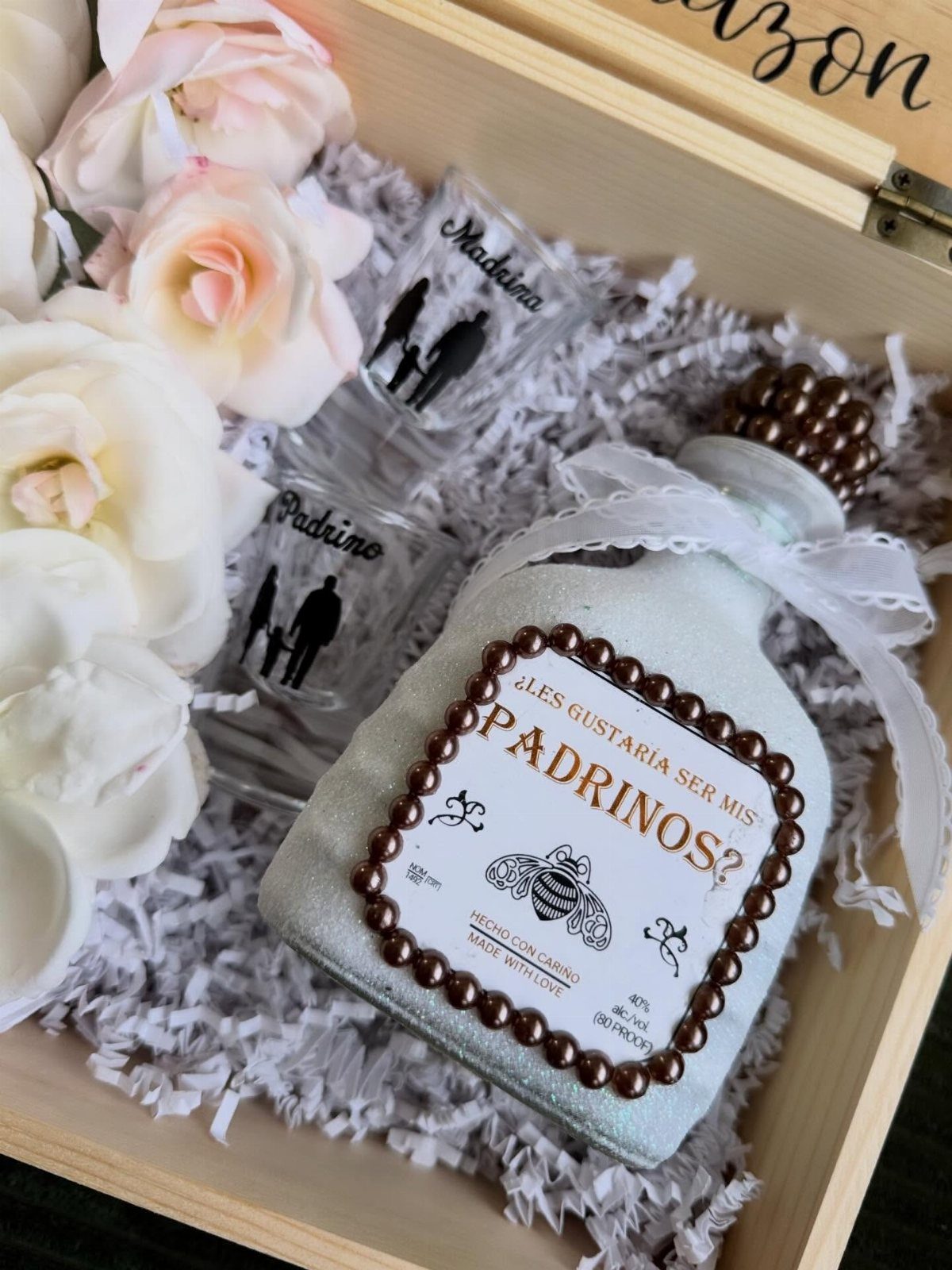 7 Godparent Proposal Box Ideas to Make the Ask Special 2 Wooden proposal box with frosted bottle, personalized shot glasses, and pink and white roses.