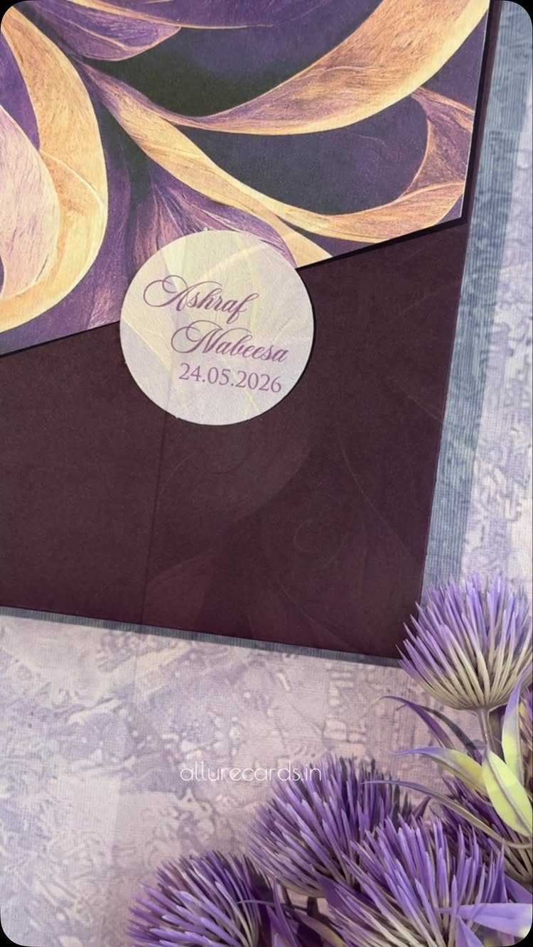 Deep purple wedding invitation with a gold liner and a circular name tag.
