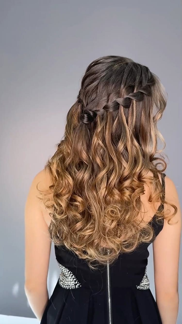 18 Hoco Updo Hairstyles From Braids to Sleek Buns 3 Long wavy brown hair styled with a delicate cascading braid and loose curls.