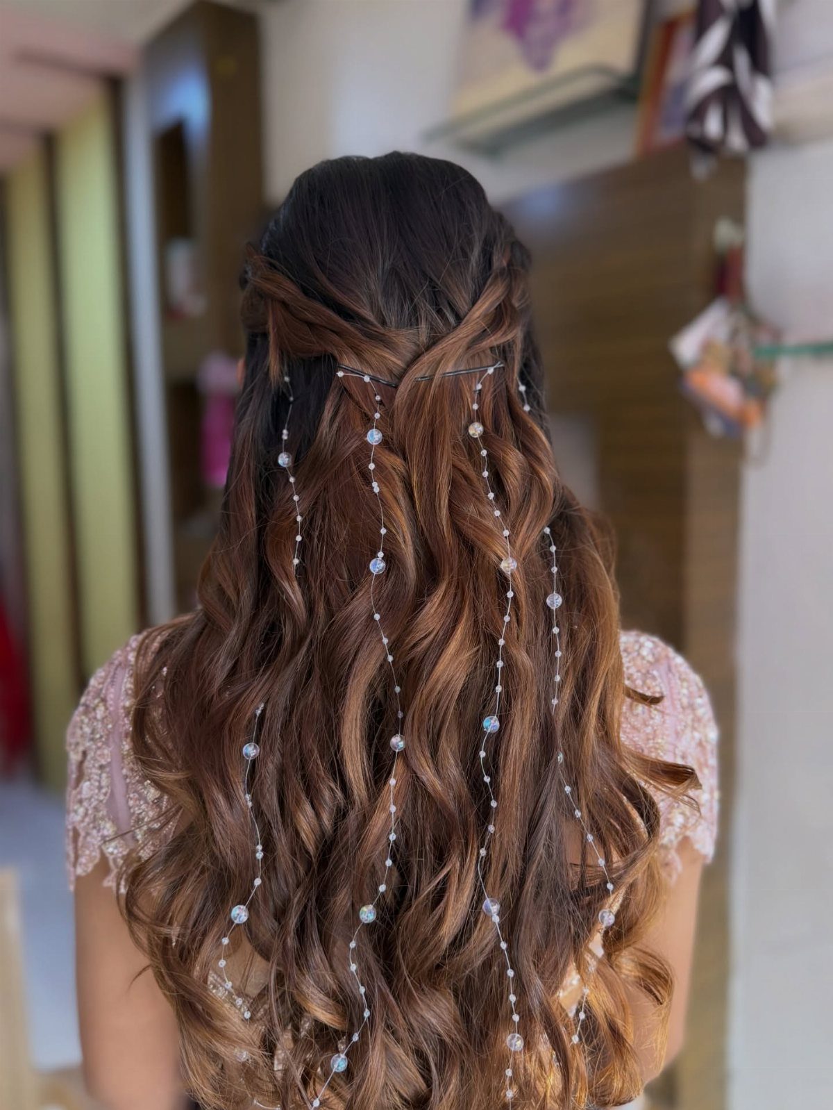 16 Long Hair Half Up Half Down Hairstyles for Real Life 13 Long wavy brown hair styled half-up with cascading white pearl strands through the waves.