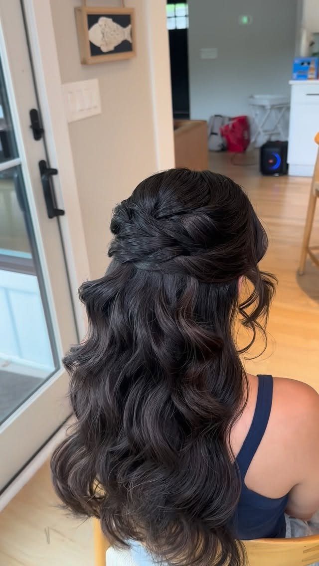 16 Long Hair Half Up Half Down Hairstyles for Real Life 5 Long dark wavy hair styled in a half-up, half-down twisted hairstyle seen from behind.