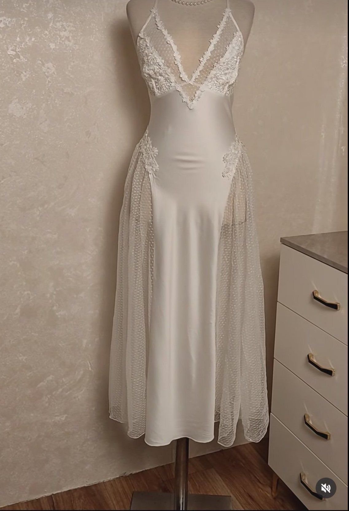 White satin nightgown with lace bodice and sheer lace overlay on a mannequin.