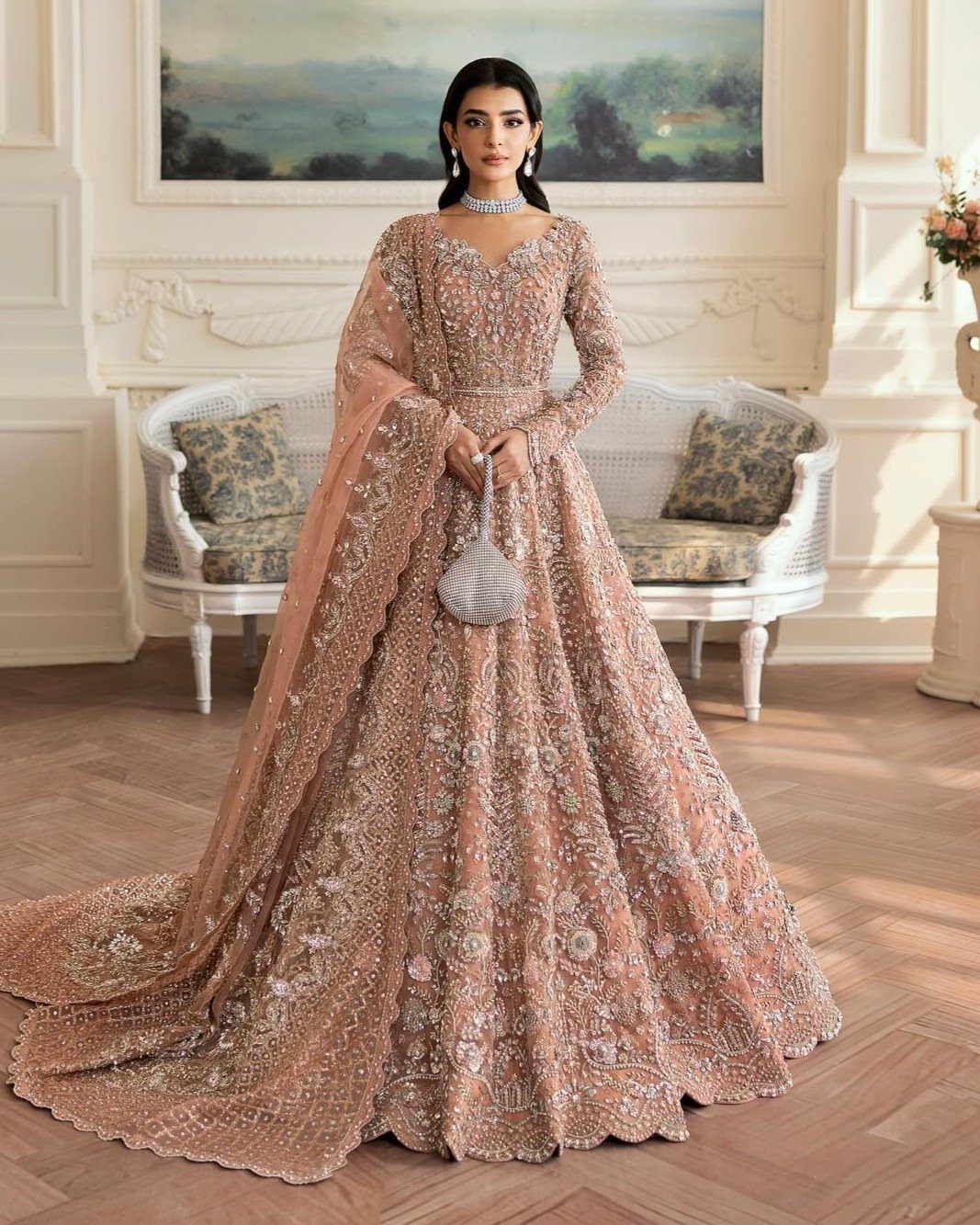 26 Nikah Dress Ideas for Your Perfect Wedding Ceremony 3 Woman in a heavily embellished blush pink bridal gown with a matching dupatta.