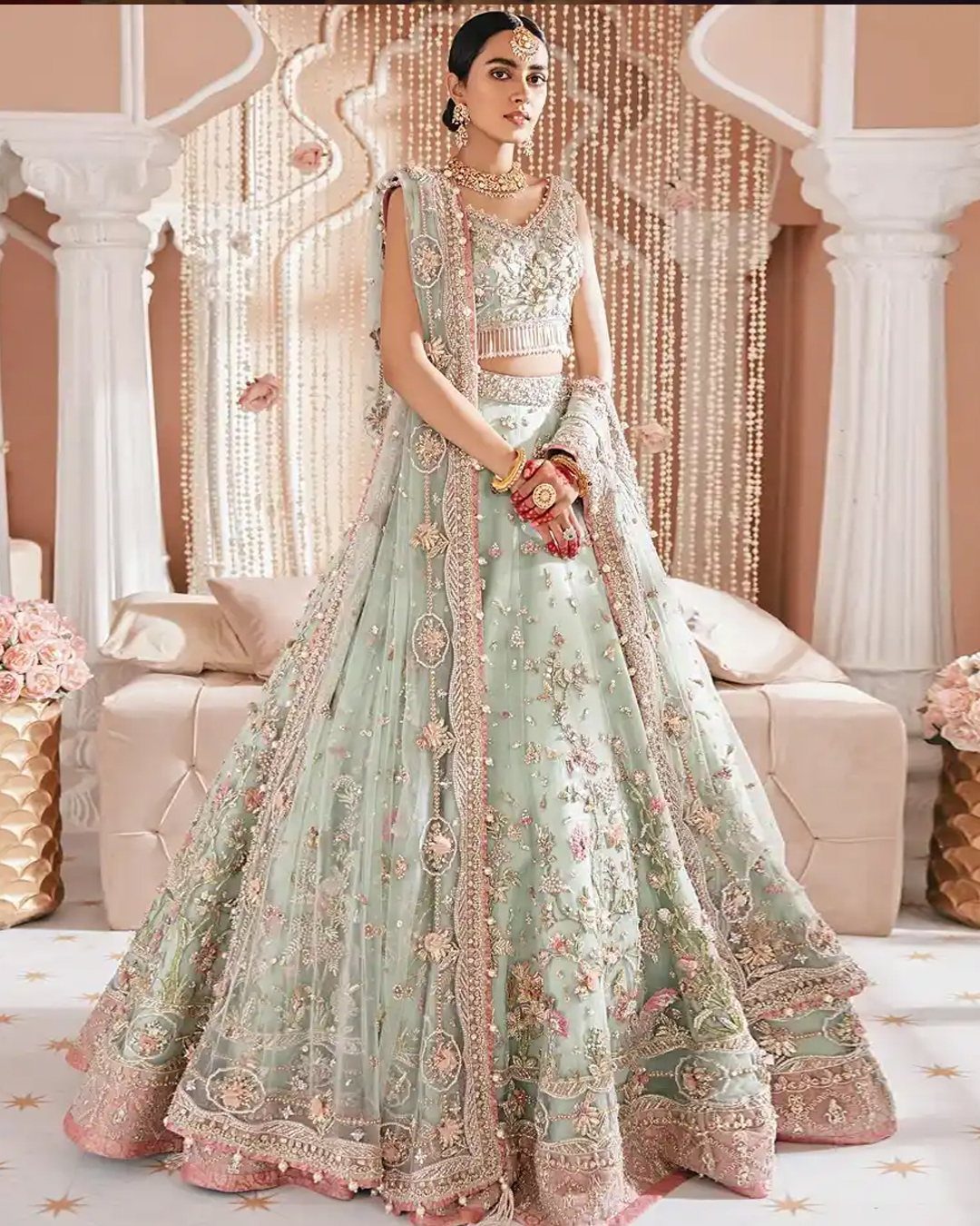 26 Nikah Dress Ideas for Your Perfect Wedding Ceremony 13 Woman in a mint green embellished lehenga with gold embroidery and matching dupatta.