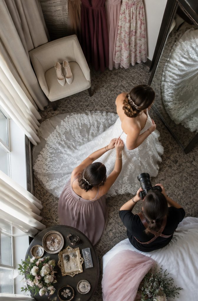 Perfect Wedding Photos: 8 Preparation Ideas for 2026 7 Hotel room with coffee cup and accessories scattered around.