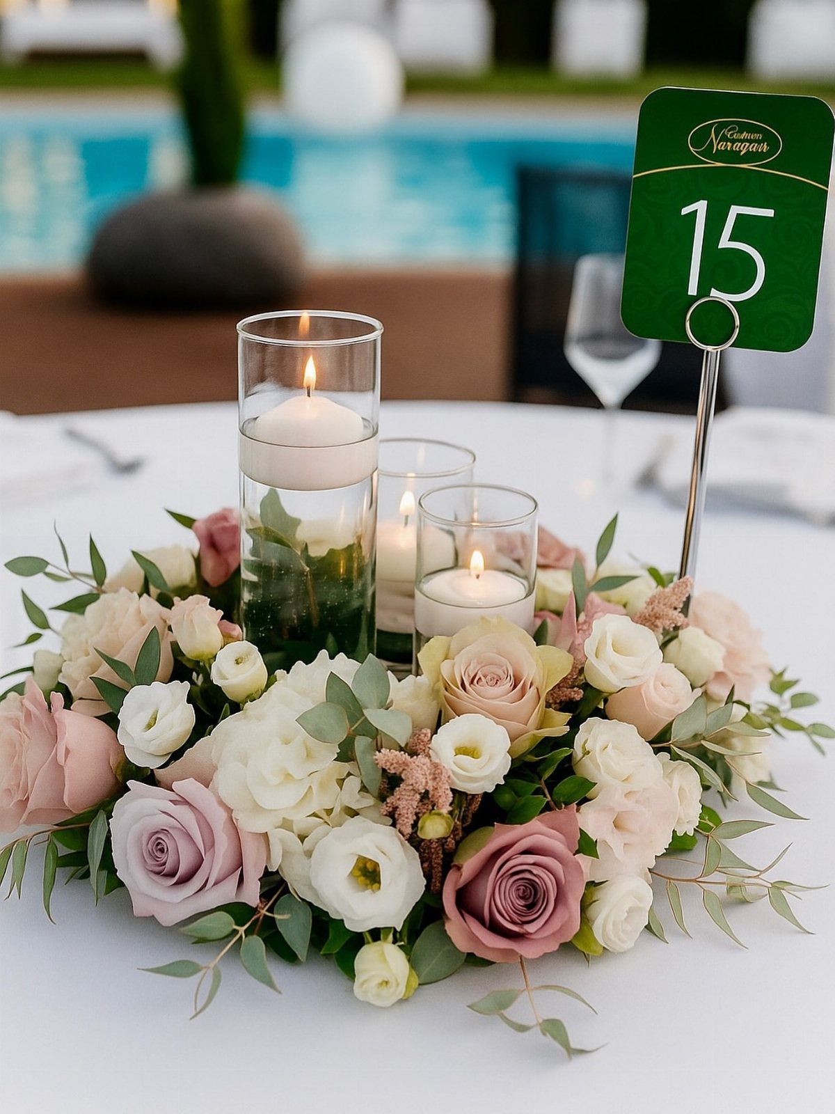 13 Round Table Wedding Decor Ideas: From S-Curved Layouts to Draped Florals 2 Floral wreath centerpiece with roses and floating candles on a white wedding table.