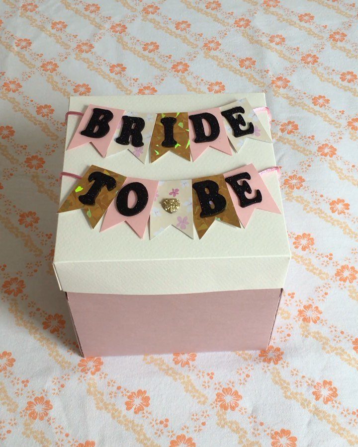 Sister Wedding Gift Ideas: 34 Picks She'll Treasure 35 Pink and white gift box with Bride To Be bunting banners on floral fabric