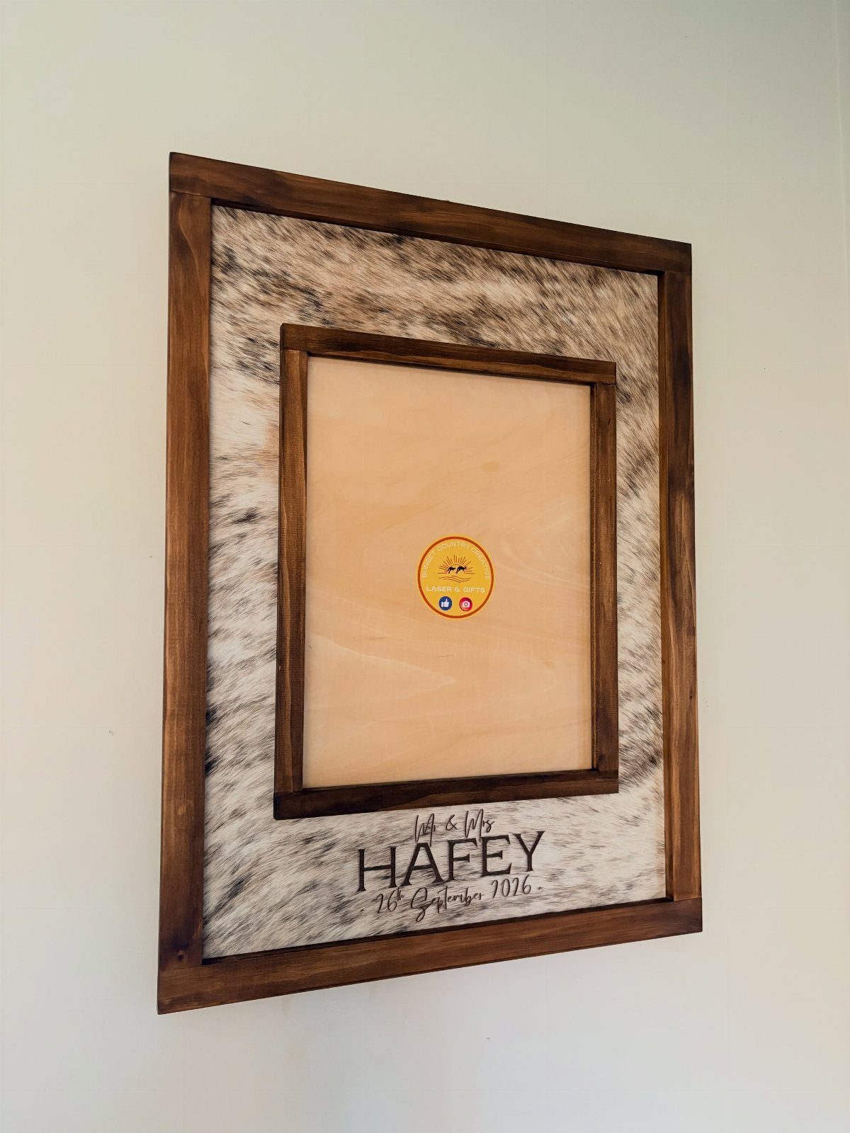 Sister Wedding Gift Ideas: 34 Picks She'll Treasure 13 Engraved wooden picture frame with cowhide border and personalized wedding name and date.