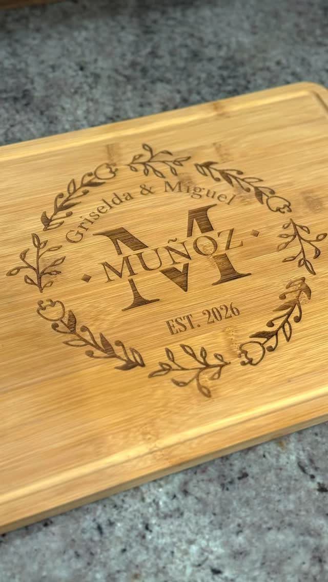 Sister Wedding Gift Ideas: 34 Picks She'll Treasure 27 Wooden cutting board engraved with a couple's names, surname, and wedding date.