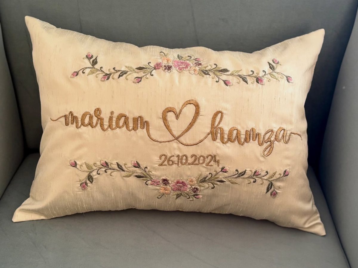 Sister Wedding Gift Ideas: 34 Picks She'll Treasure 4 Cream personalized wedding pillow with gold embroidered names, date, and floral details.