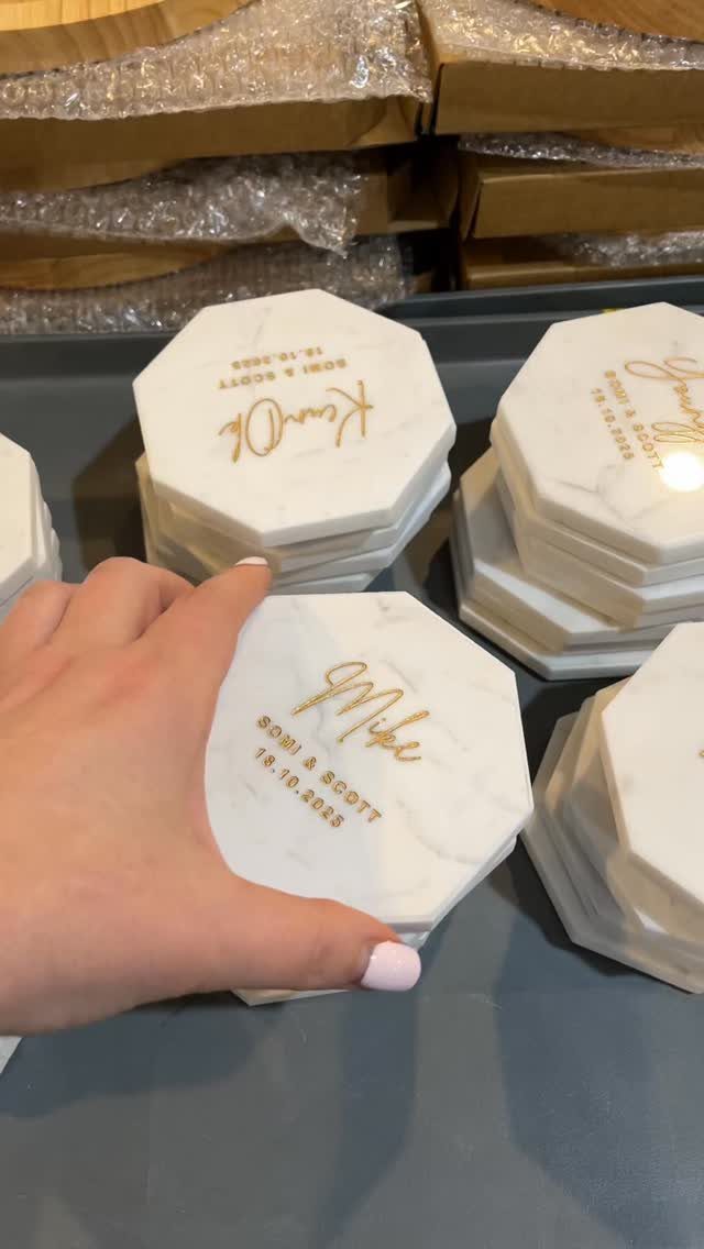 20 Small Wedding Gift Ideas for Couples Who Have Everything 15 White hexagonal marble coasters with gold engraved names and wedding date.