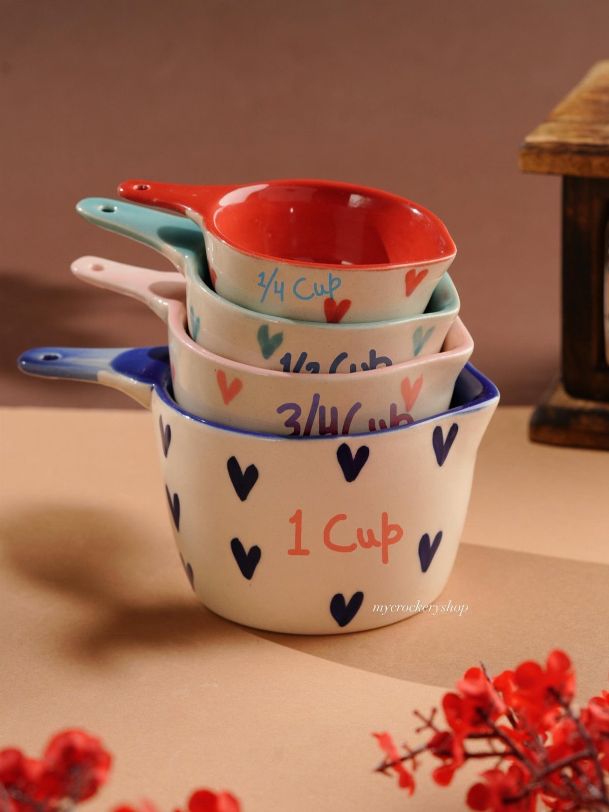20 Small Wedding Gift Ideas for Couples Who Have Everything 18 Stacked ceramic measuring cups with heart patterns and handwritten measurement labels.