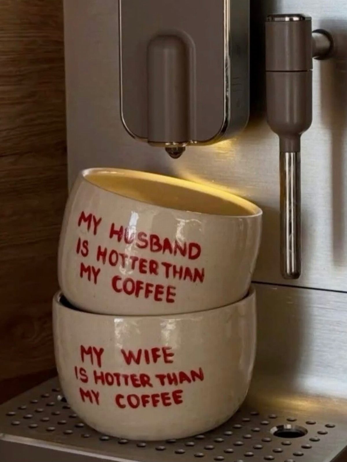 20 Small Wedding Gift Ideas for Couples Who Have Everything 4 Two white ceramic mugs with funny red text stacked under a coffee machine.