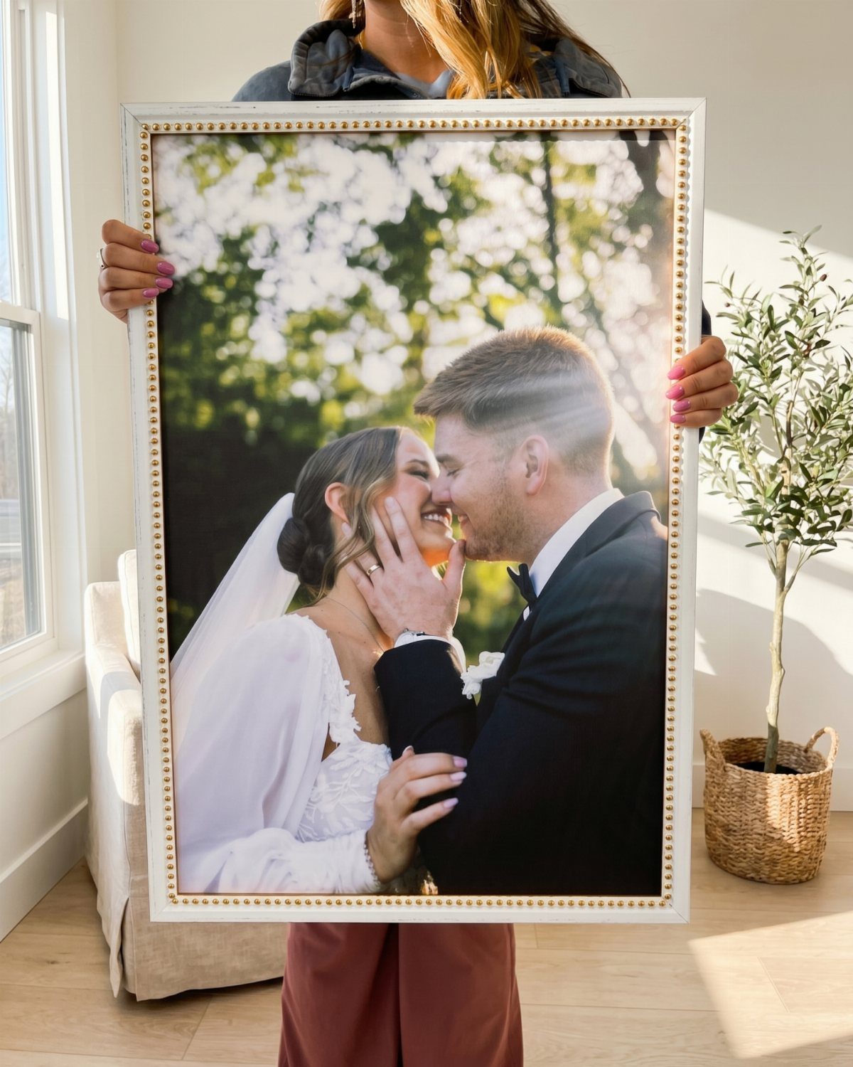 20 Small Wedding Gift Ideas for Couples Who Have Everything 2 Large white frame holding a wedding photo of a smiling bride and groom.
