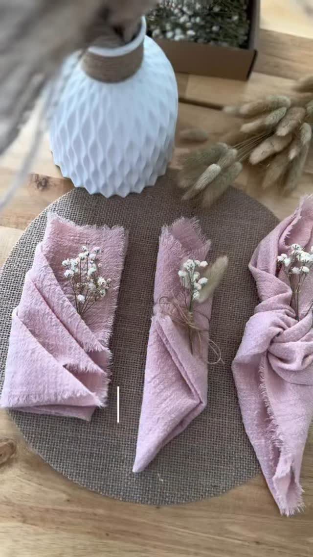 35 Backyard Wedding Reception Ideas for an Unforgettable Day 35 Pink linen napkins with white flowers on a burlap placemat and wooden table.