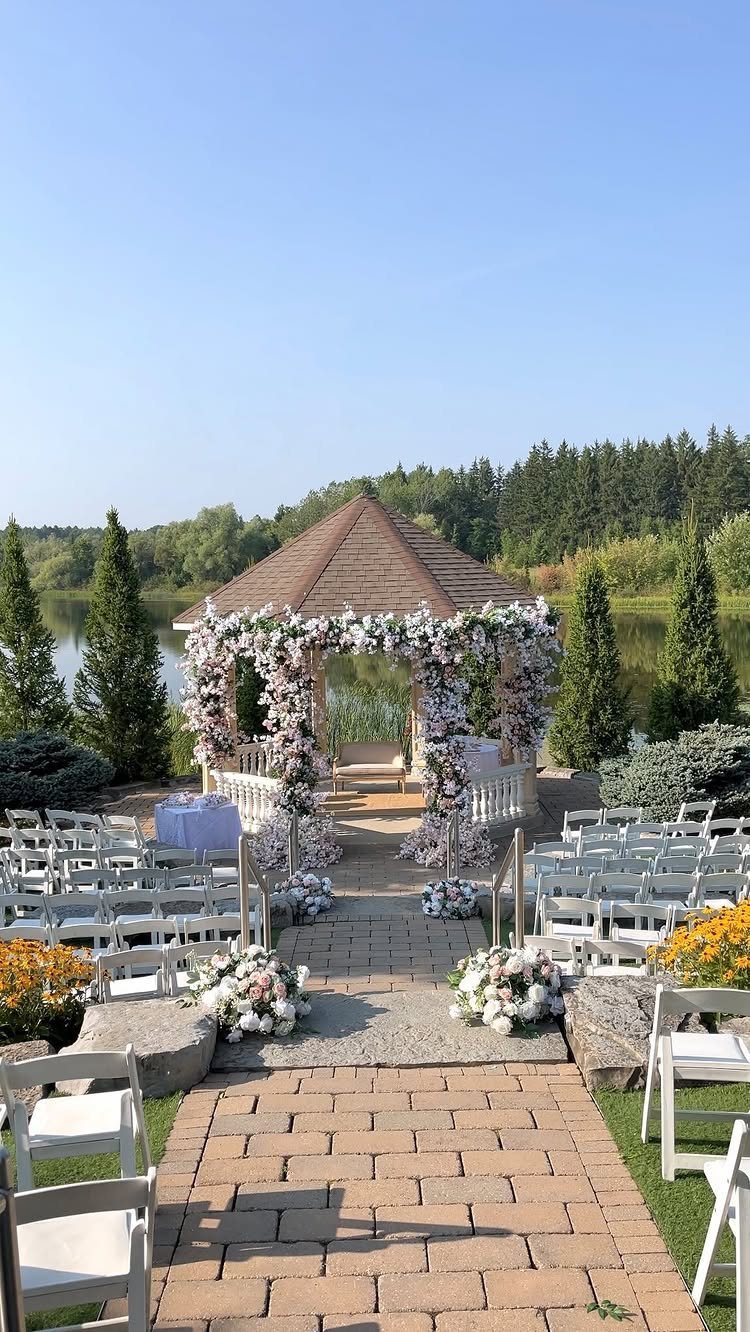 35 Backyard Wedding Reception Ideas for an Unforgettable Day 7 Floral wedding arch with white and pink flowers in front of a gazebo.