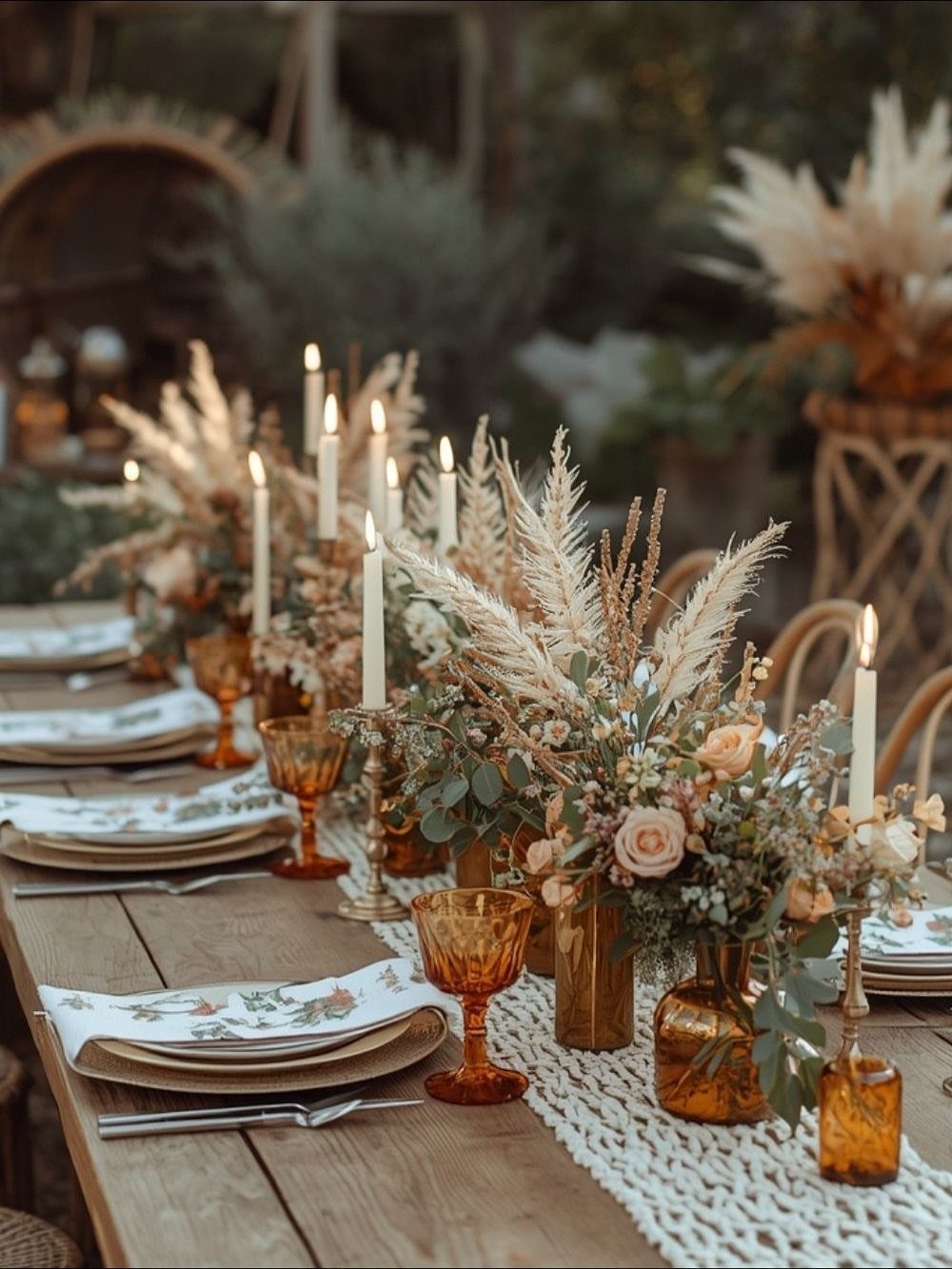 Wedding Decor Brown: How to Use It in 8 Elegant Ways 4 A rustic wooden wedding table decorated with pampas grass, amber glasses, and white taper candles.
