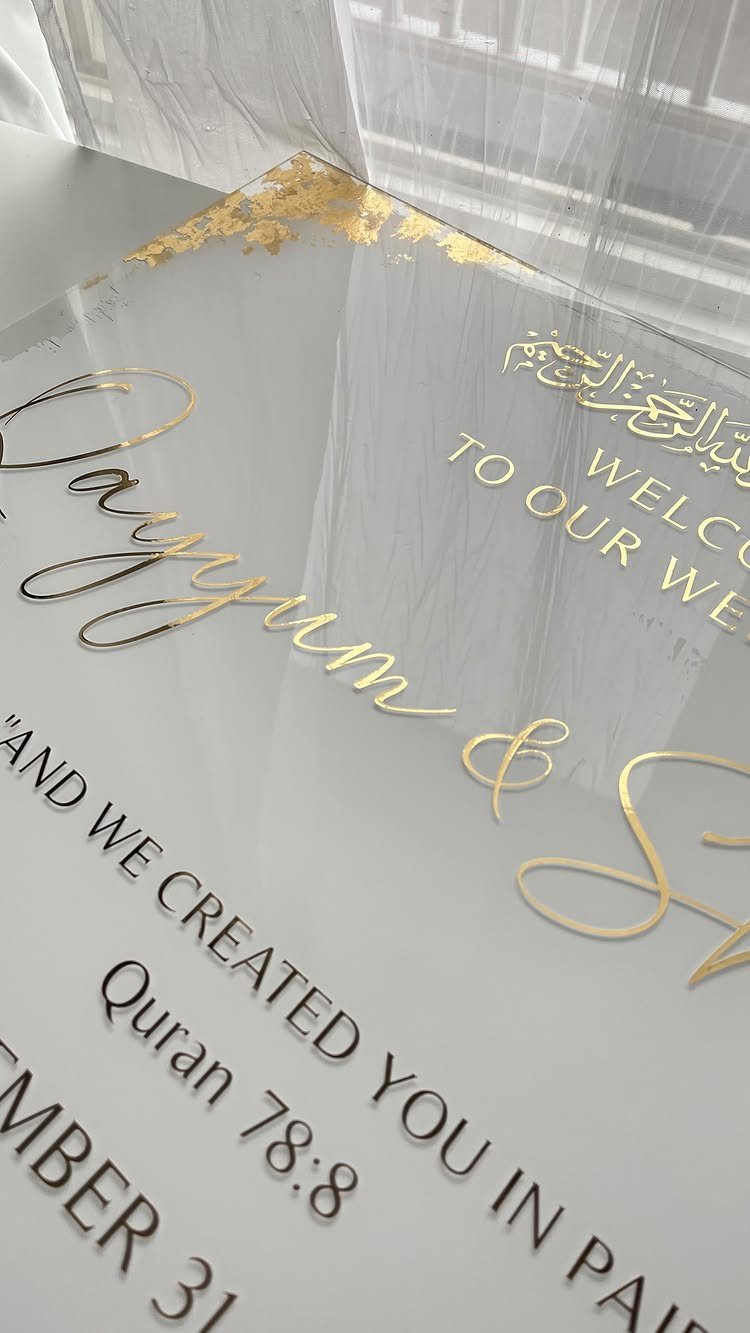 Wedding Decor Quotes: 7 Display Ideas From Letterboard to Acrylic 6 Clear acrylic wedding sign with elegant gold lettering and Quranic scripture verse.