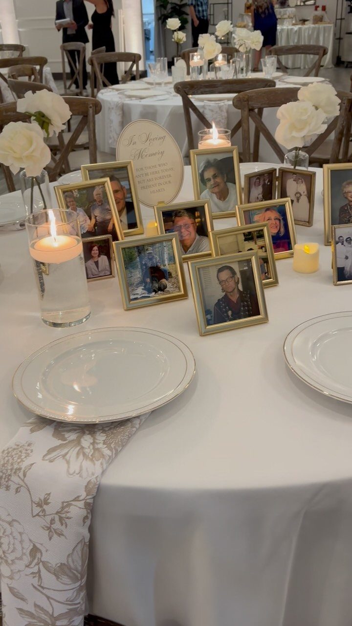 Wedding Detail Shots: 21 Ideas for Your Photographer 5 Gold-framed photographs of loved ones arranged on a white wedding table with candles and flowers.