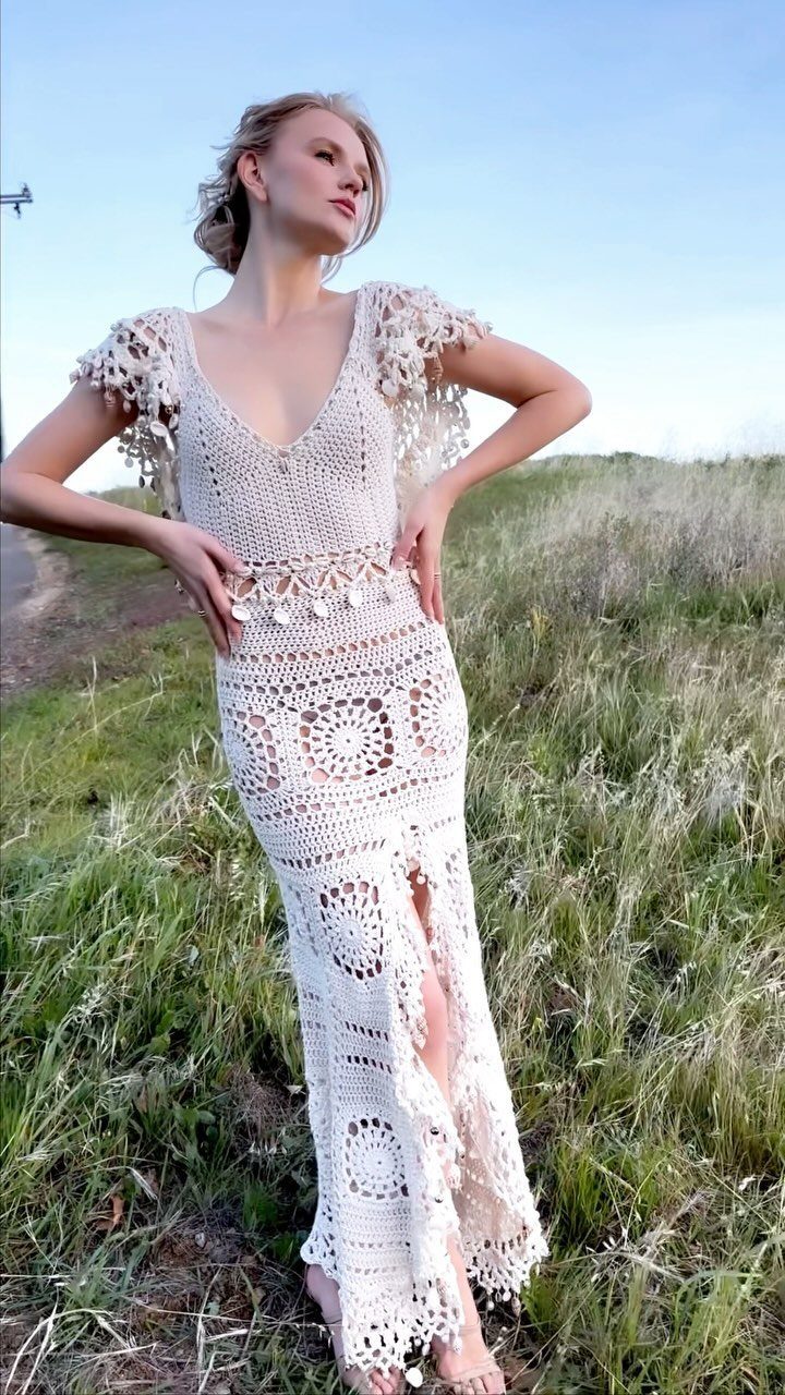 Tight Lace Wedding Dresses in 25 Beautiful Styles 14 Woman in a white crochet lace dress with a front slit in a grassy field