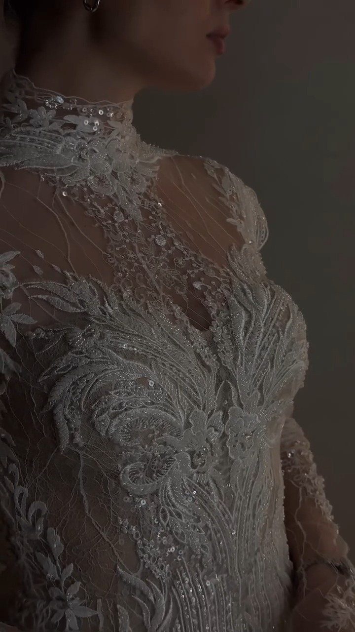 Tight Lace Wedding Dresses in 25 Beautiful Styles 4 White lace wedding dress with high neckline and intricate floral sequin embroidery.