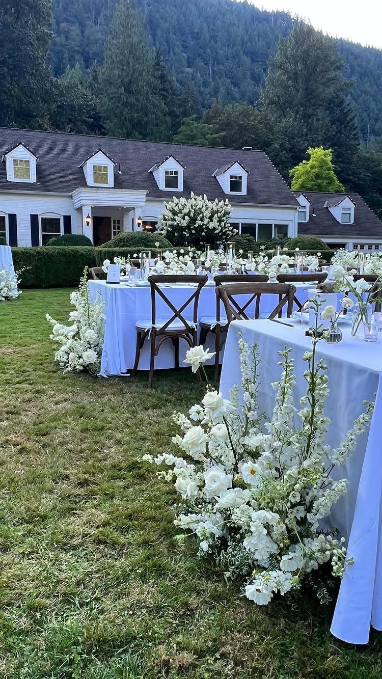 Wedding Flower Trends: 36 Ideas from Jewel Tones to Arches 8 White meadow-style floral arrangements growing around the base of outdoor wedding reception tables.