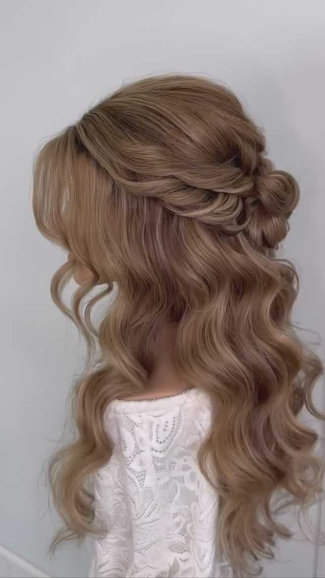 Blonde medium hair in a half-up half-down style with twists and loose curls.