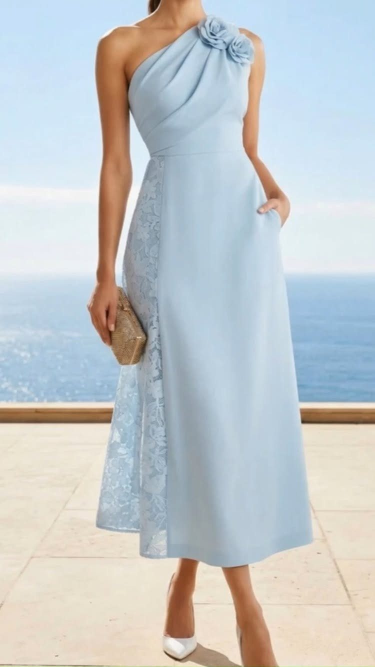 Wedding Outfit Outdoor: 9 Guest Looks for Every Setting 9 Woman in a light blue one-shoulder midi dress standing by the ocean.
