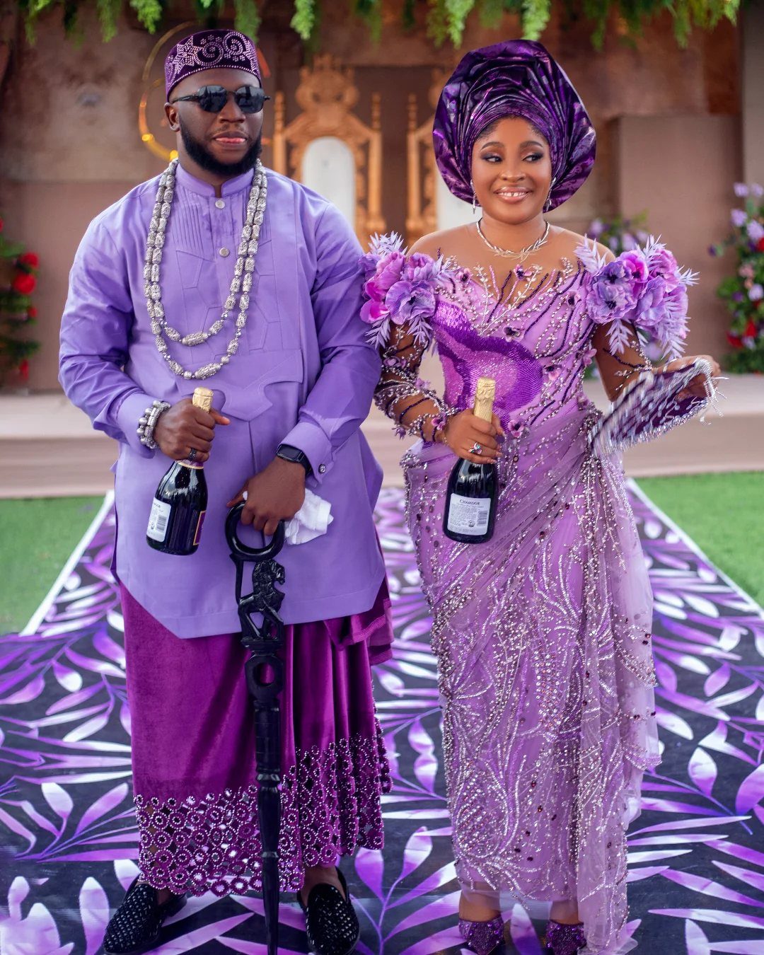 Wedding Theme and Motif: 16 Fresh Ideas for 2026 10 A man and woman dressed in ornate purple traditional Nigerian wedding attire posing together.