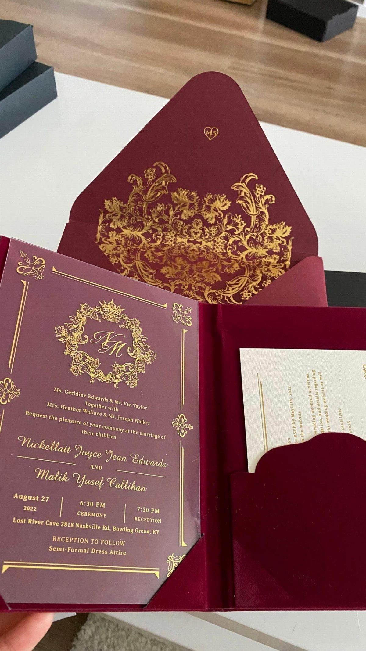 8 Wedding Theme Red and Gold Ideas for Every Part of Your Day 2 Burgundy wedding invitation with gold foil damask patterns and elegant calligraphy on a white card.