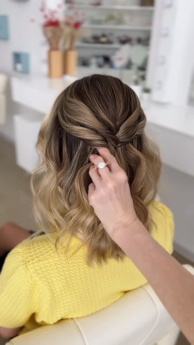 27 Bridesmaid Wedding Updo Hairstyles from Buns to Braids 17 Blonde hair in a half-up half-down style with a twisted section pinned back.