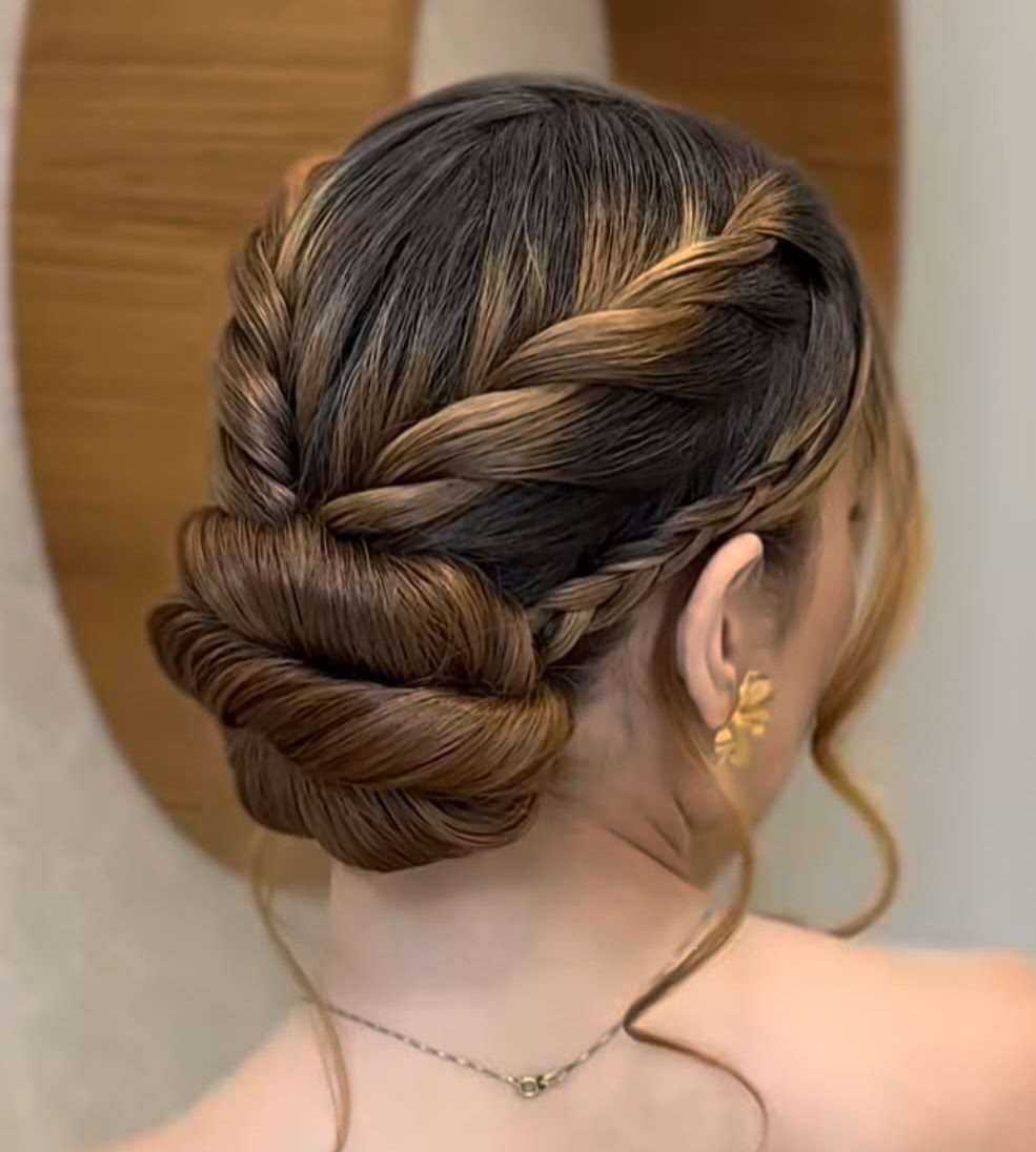 Wedding Updo Low Bun: How to Style 17 Beautiful Ideas 11 Braided low bun hairstyle on brown hair with a polished, elegant finish.