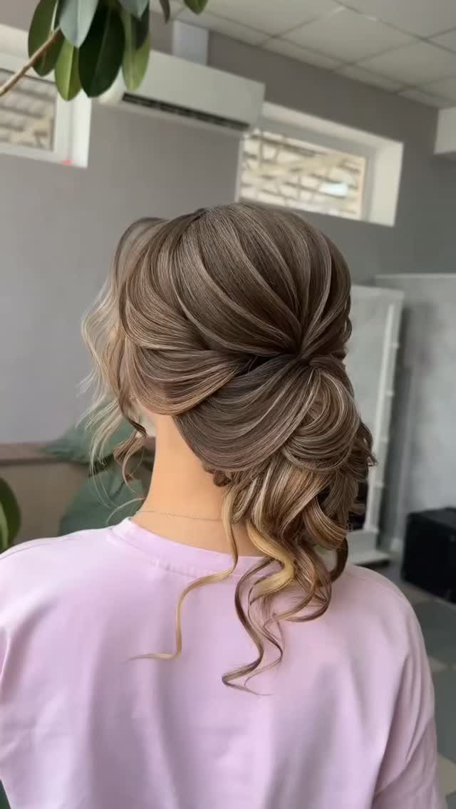 Wedding Updo Low Bun: How to Style 17 Beautiful Ideas 6 Polished low chignon updo with loose curls on a woman with brown hair.