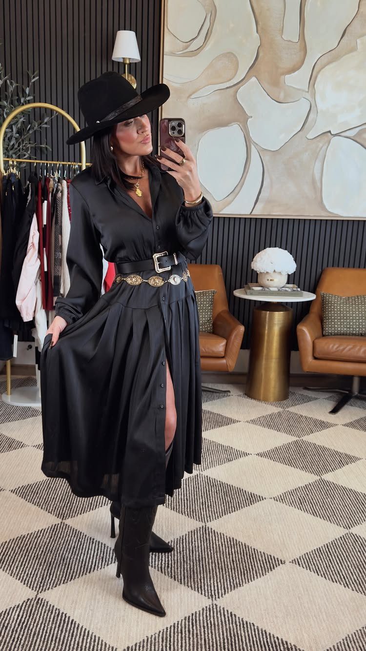 What Are the Best Western Themed Wedding Ideas? 37 Here 18 Woman wearing a black dress, cowboy hat, and black cowboy boots for a western look.