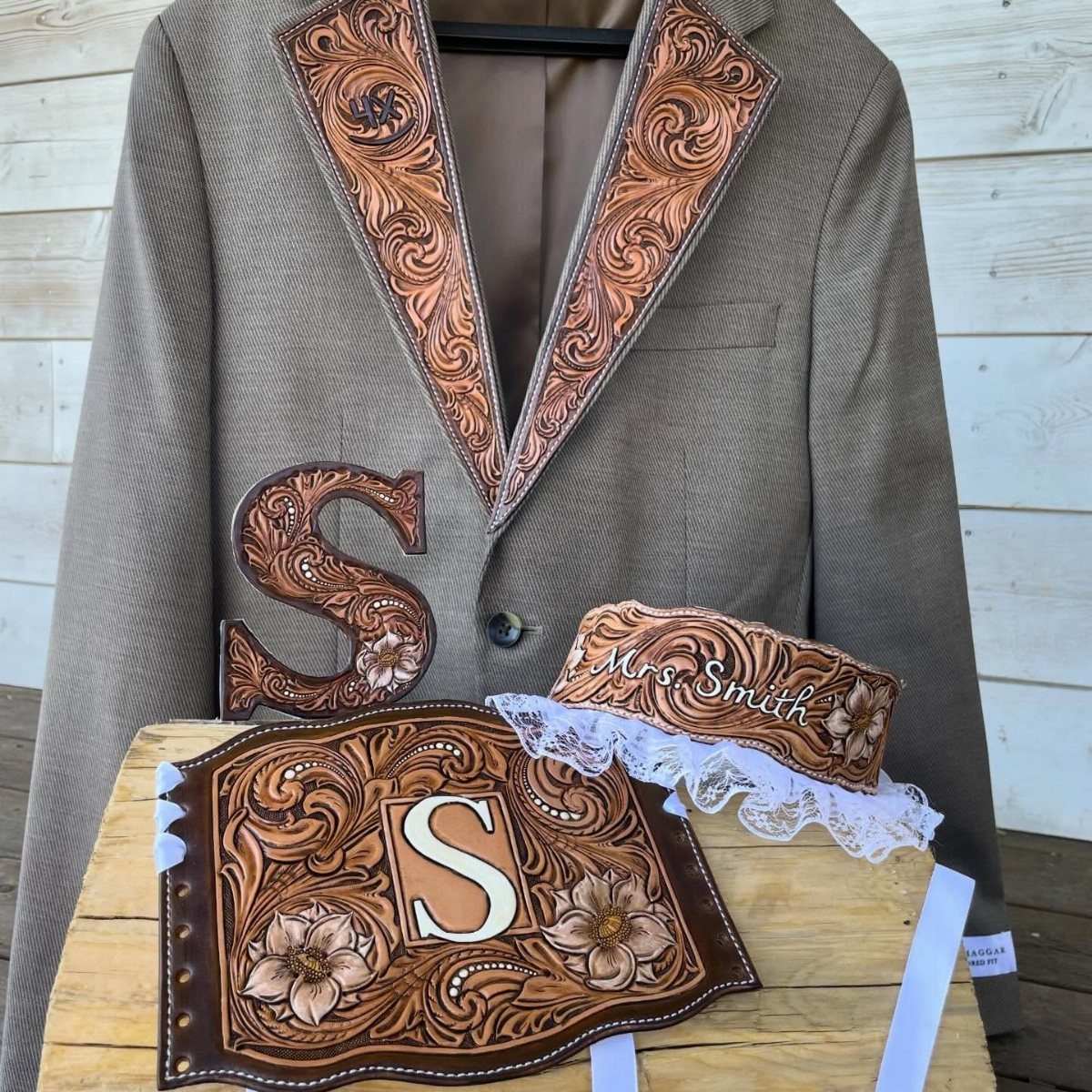 What Are the Best Western Themed Wedding Ideas? 37 Here 25 Custom carved leather wedding accessories displayed with a tan blazer and wooden board.