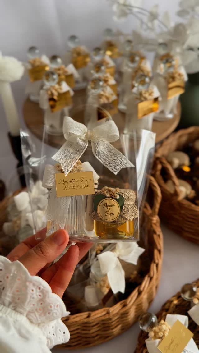 White Wedding Ideas: 23 Elegant Details for Your Big Day 16 Small honey jar wedding favors in clear boxes with white ribbons and burlap lids.